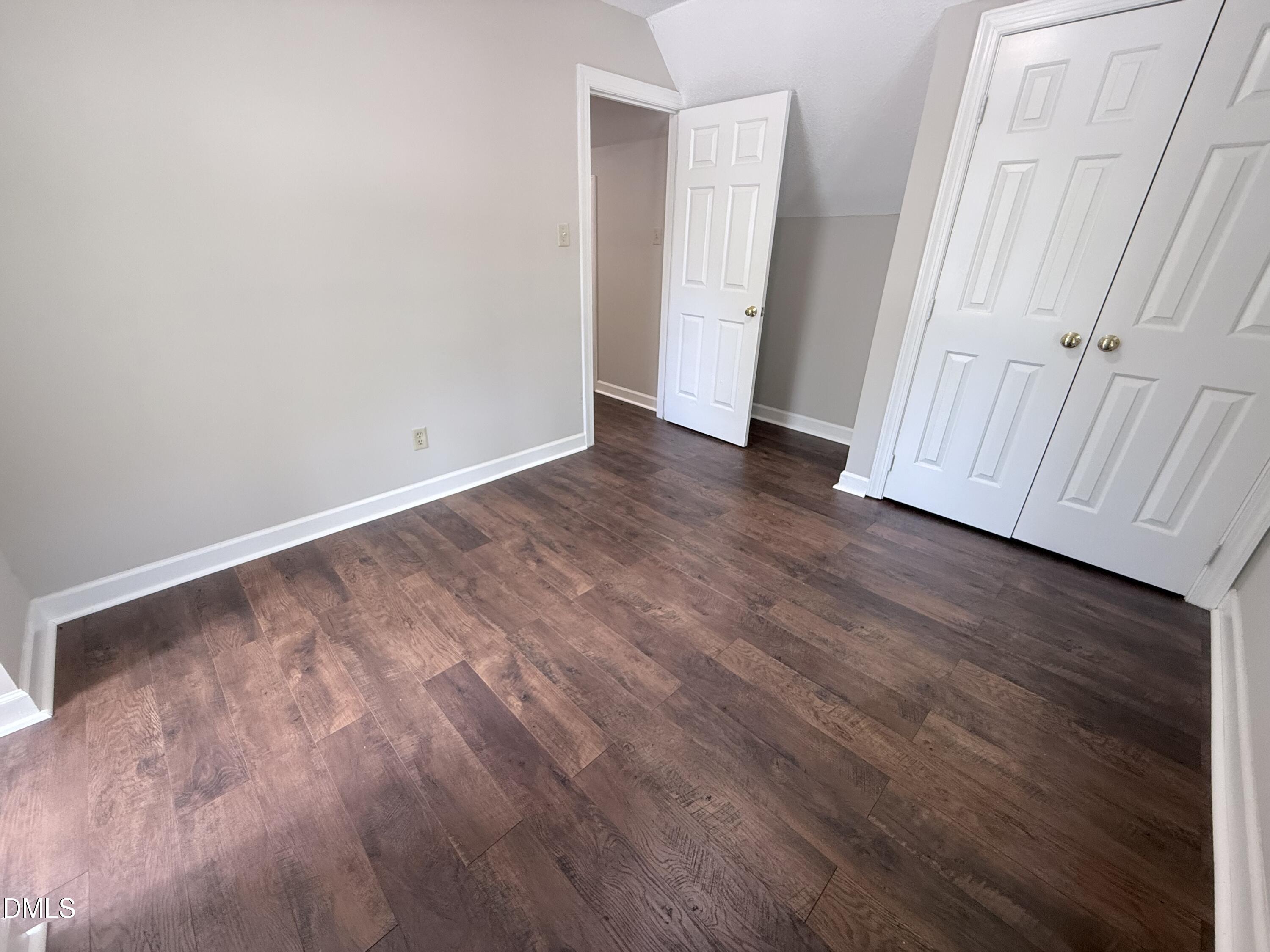 2900 Broadlands Drive Raleigh, NC 27604 - Photo 51 of 60 a view of an empty room with wooden floor and closet