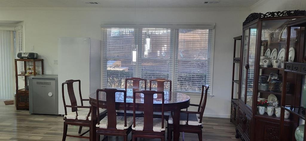2341 Park Valley Way Dacula, GA 30019 - Photo 11 of 38 a view of a dining room with furniture and wooden floor