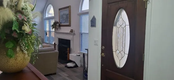 a view of a livingroom with furniture and entryway