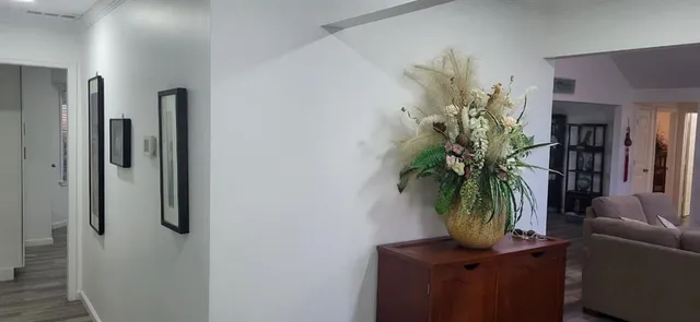 a flower room with furniture and a potted plant