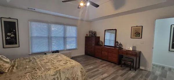 a bedroom with a bed and a dresser