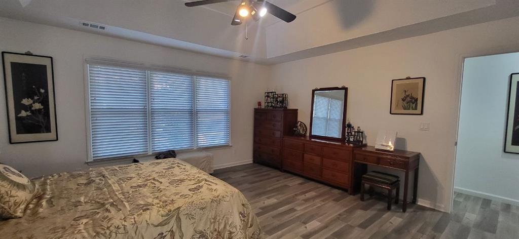 2341 Park Valley Way Dacula, GA 30019 - Photo 24 of 38 a bedroom with a bed and a dresser