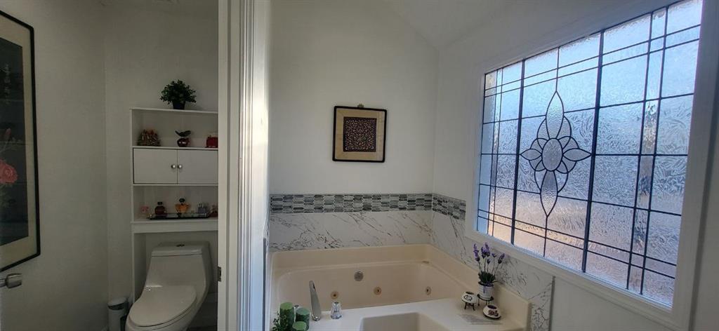 2341 Park Valley Way Dacula, GA 30019 - Photo 31 of 38 a bathroom with a bathtub and shower