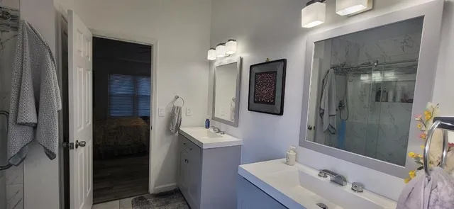 a view of entryway and hall with wooden floor