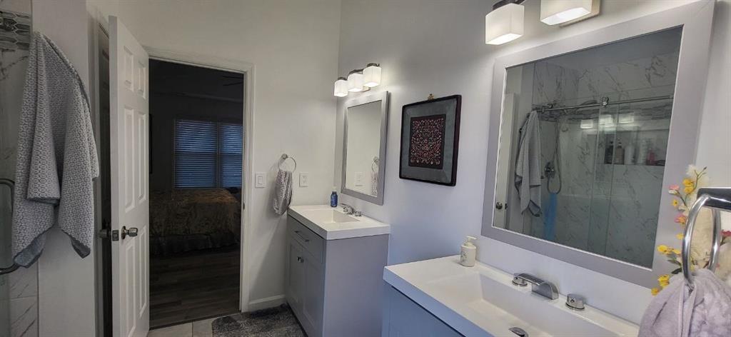 2341 Park Valley Way Dacula, GA 30019 - Photo 32 of 38 a bathroom with a sink and a mirror