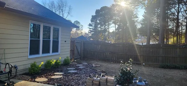 a view of a house with backyard sitting area and porch