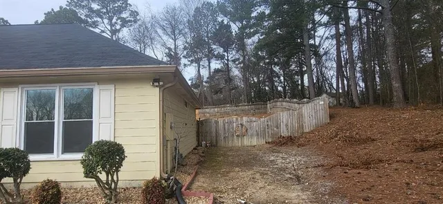 a house view with a backyard space
