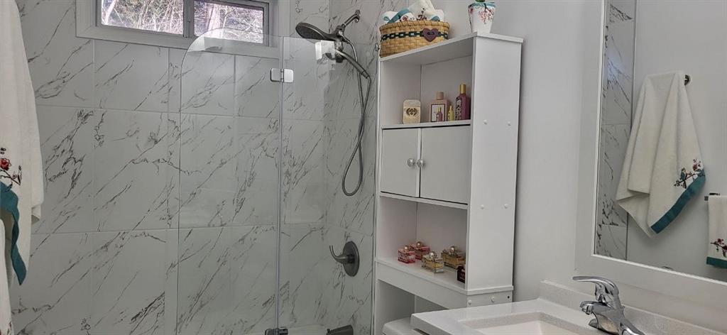 2341 Park Valley Way Dacula, GA 30019 - Photo 9 of 38 a bathroom with a sink and mirror with toilet