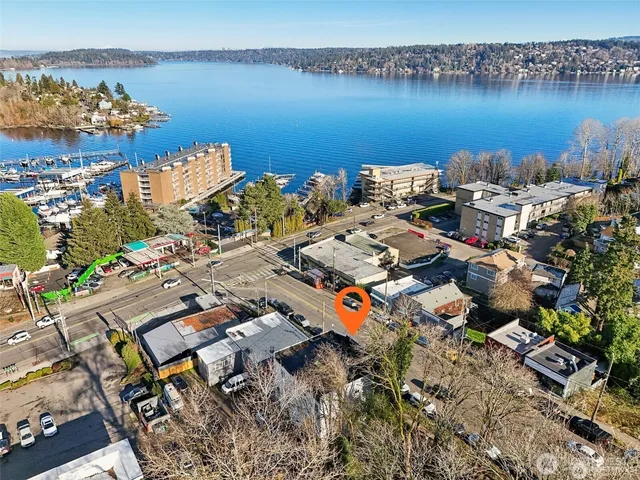 an aerial view of a house with a lake view
