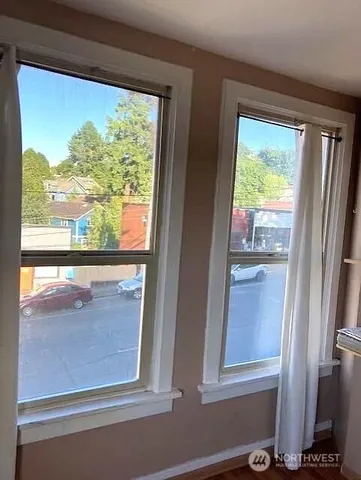 a view of a room that has a large window