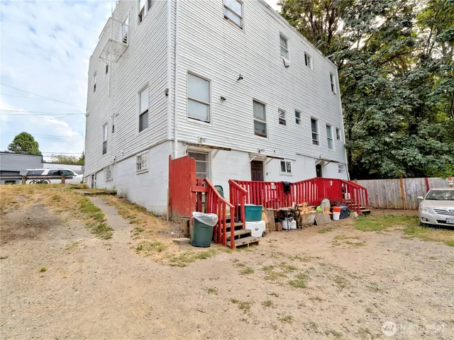an outdoor space with patio and snow on the road