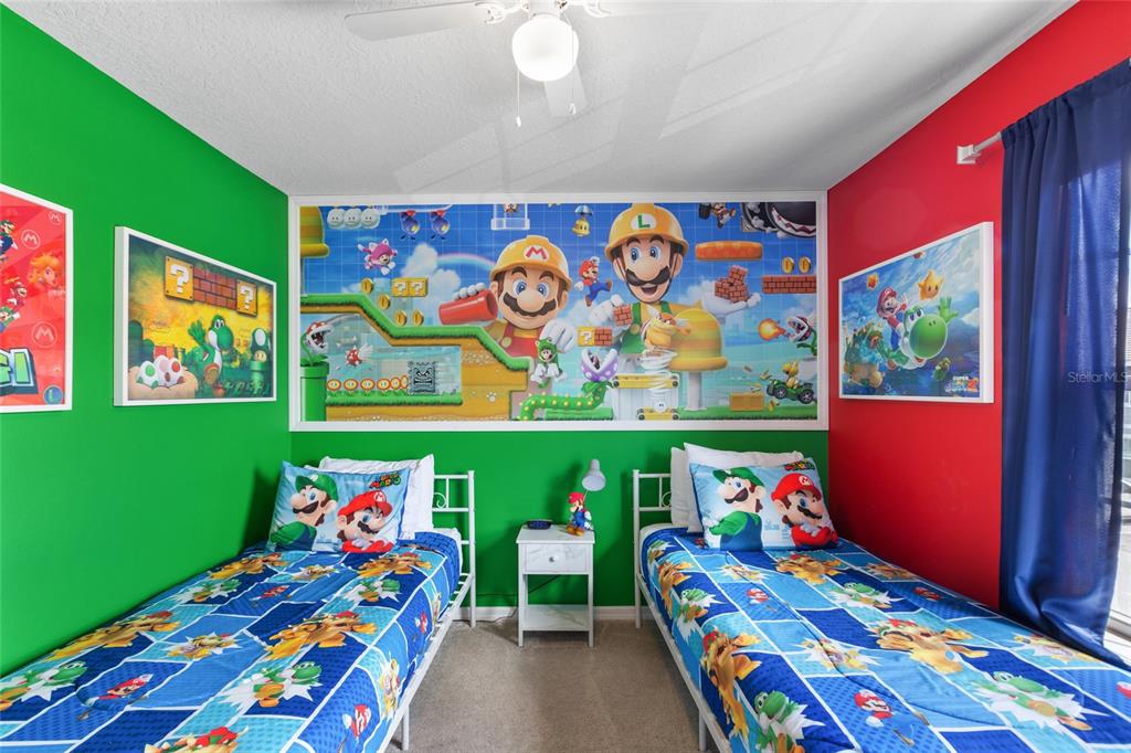 7160 Oakmoss Loop Davenport, FL 33837 - Photo 22 of 45 two kids room with toys and dresser