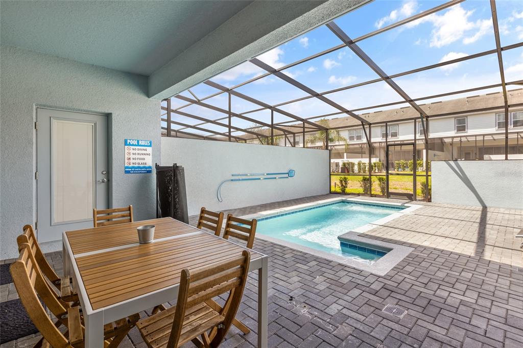 7160 Oakmoss Loop Davenport, FL 33837 - Photo 35 of 45 a bedroom with a bed and wooden floor