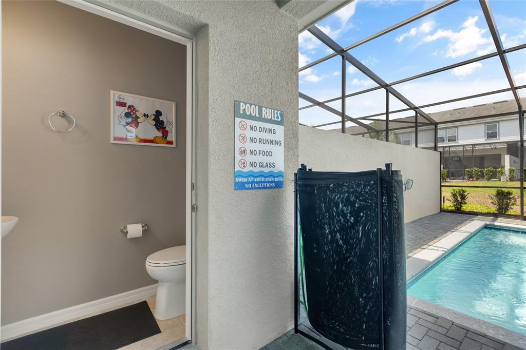 7160 Oakmoss Loop Davenport, FL 33837 - Photo 40 of 45 a bathroom with a toilet and a shower