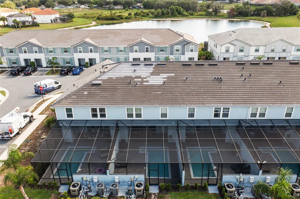 7160 Oakmoss Loop Davenport, FL 33837 - Photo 44 of 45 a aerial view of a house with a lake view
