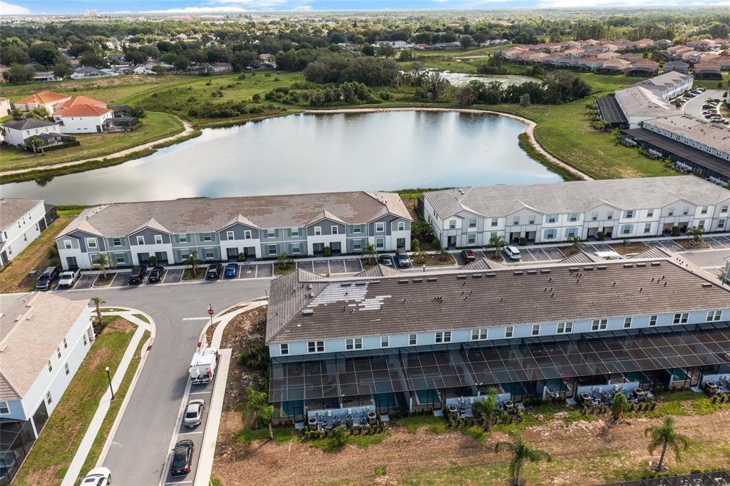 7160 Oakmoss Loop Davenport, FL 33837 - Photo 45 of 45 an aerial view of a city with a lake view