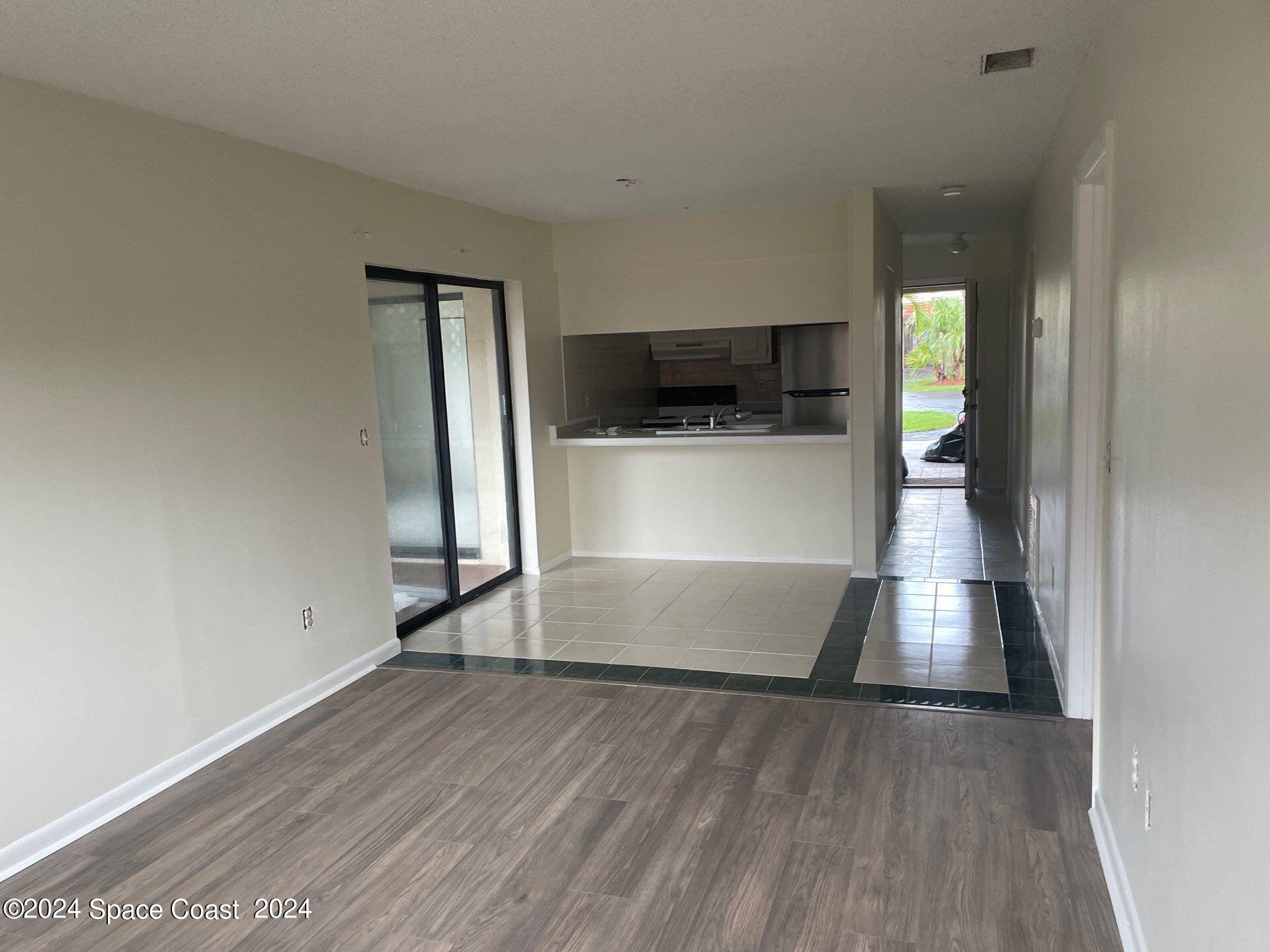 3250 Beach View Way Melbourne Beach, FL 32951 - Photo 2 of 7 a view of hallway with wooden floor and a sink