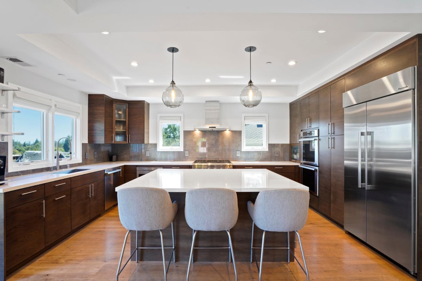 313 Oakview Drive San Carlos, CA 94070 - Photo 11 of 47 a large kitchen with a table and chairs