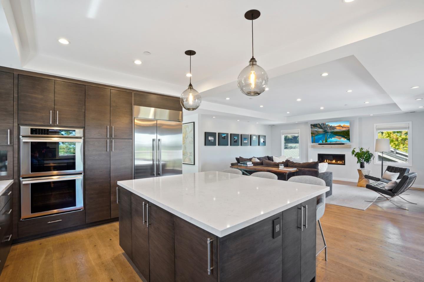 313 Oakview Drive San Carlos, CA 94070 - Photo 16 of 47 a kitchen with a stove a refrigerator and a fireplace