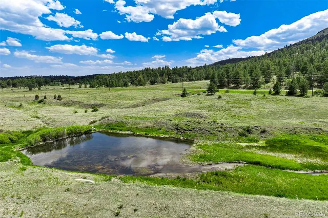 a view of a golf course with a lake