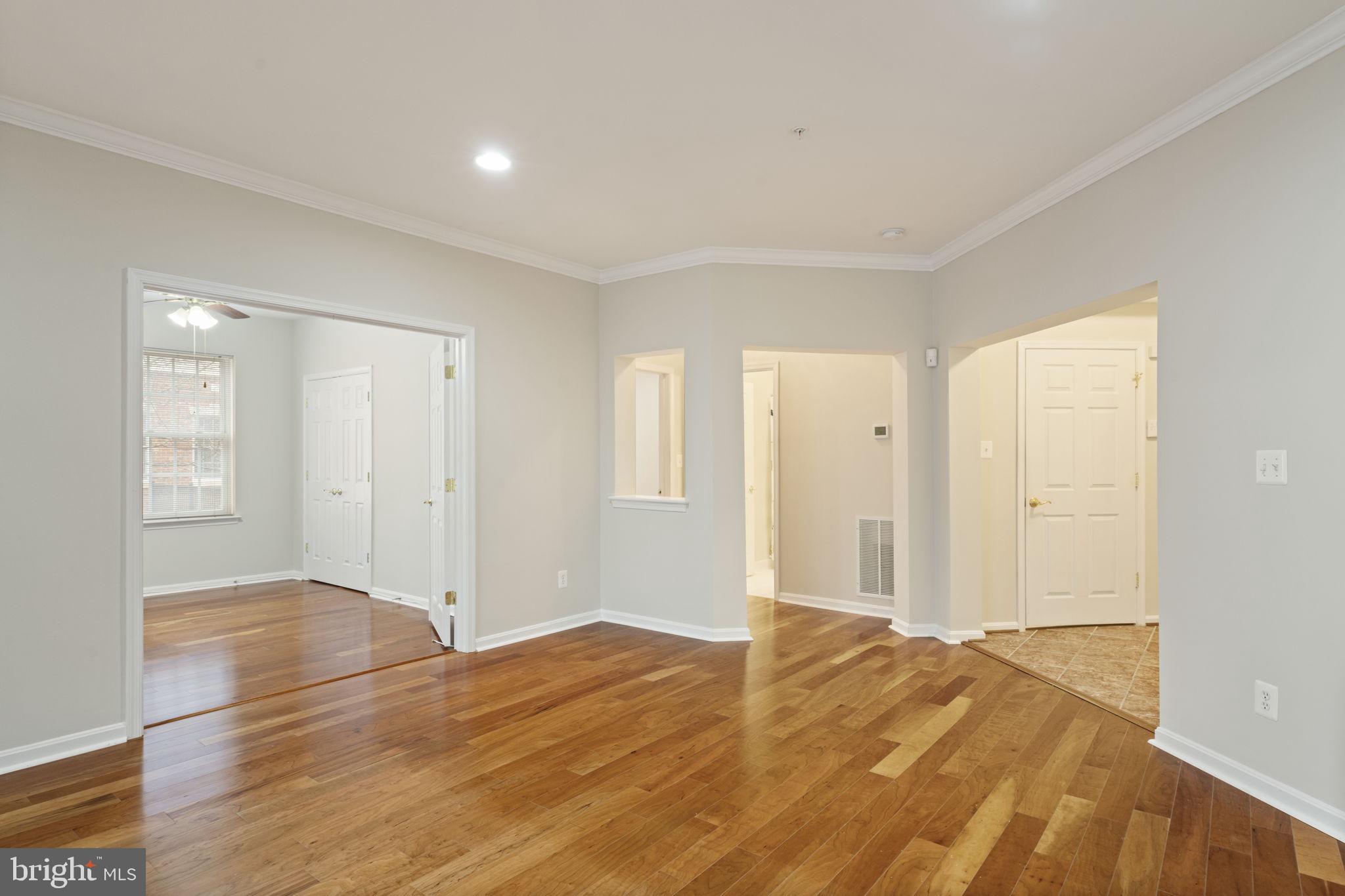 20751 Royal Palace Square, Unit 104 Sterling, VA 20165 - Photo 10 of 44 a view of a room with wooden floor and bathroom