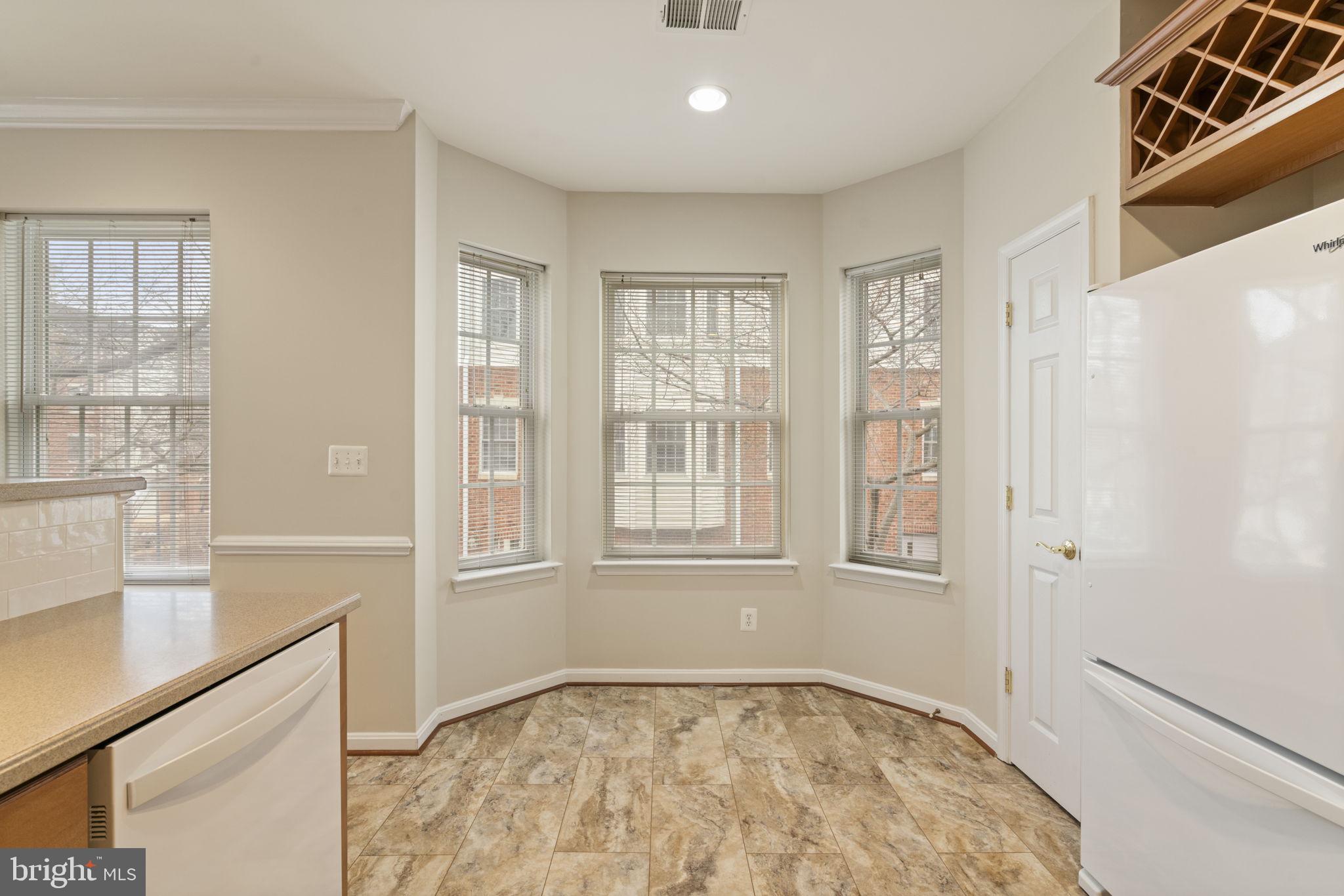20751 Royal Palace Square, Unit 104 Sterling, VA 20165 - Photo 16 of 44 a view of an empty room with a window