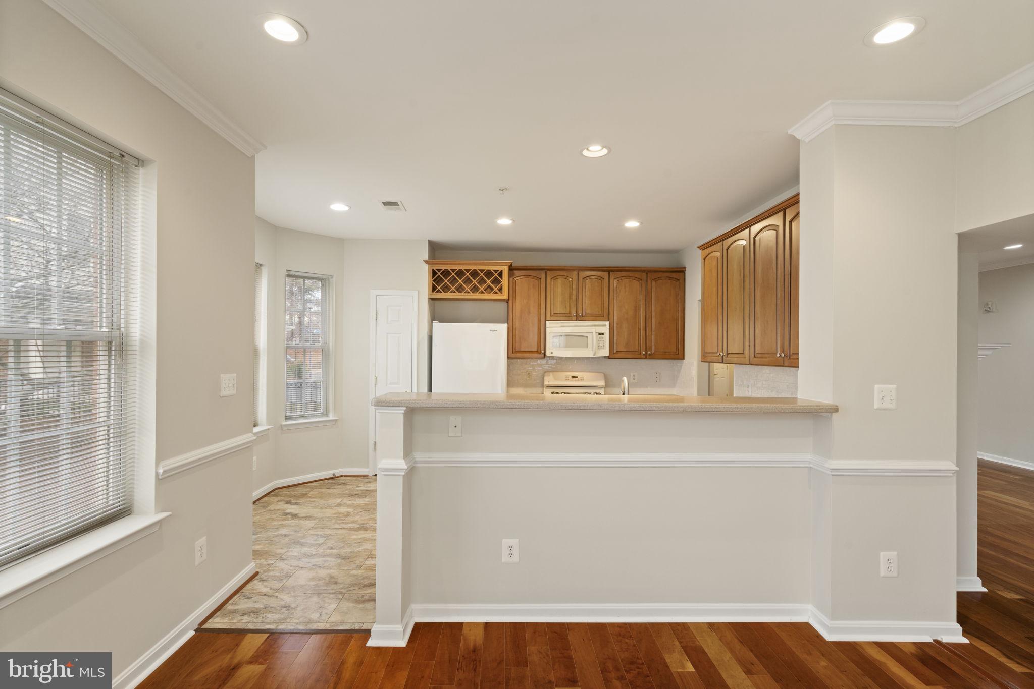 20751 Royal Palace Square, Unit 104 Sterling, VA 20165 - Photo 17 of 44 a view of kitchen with wooden floor and window
