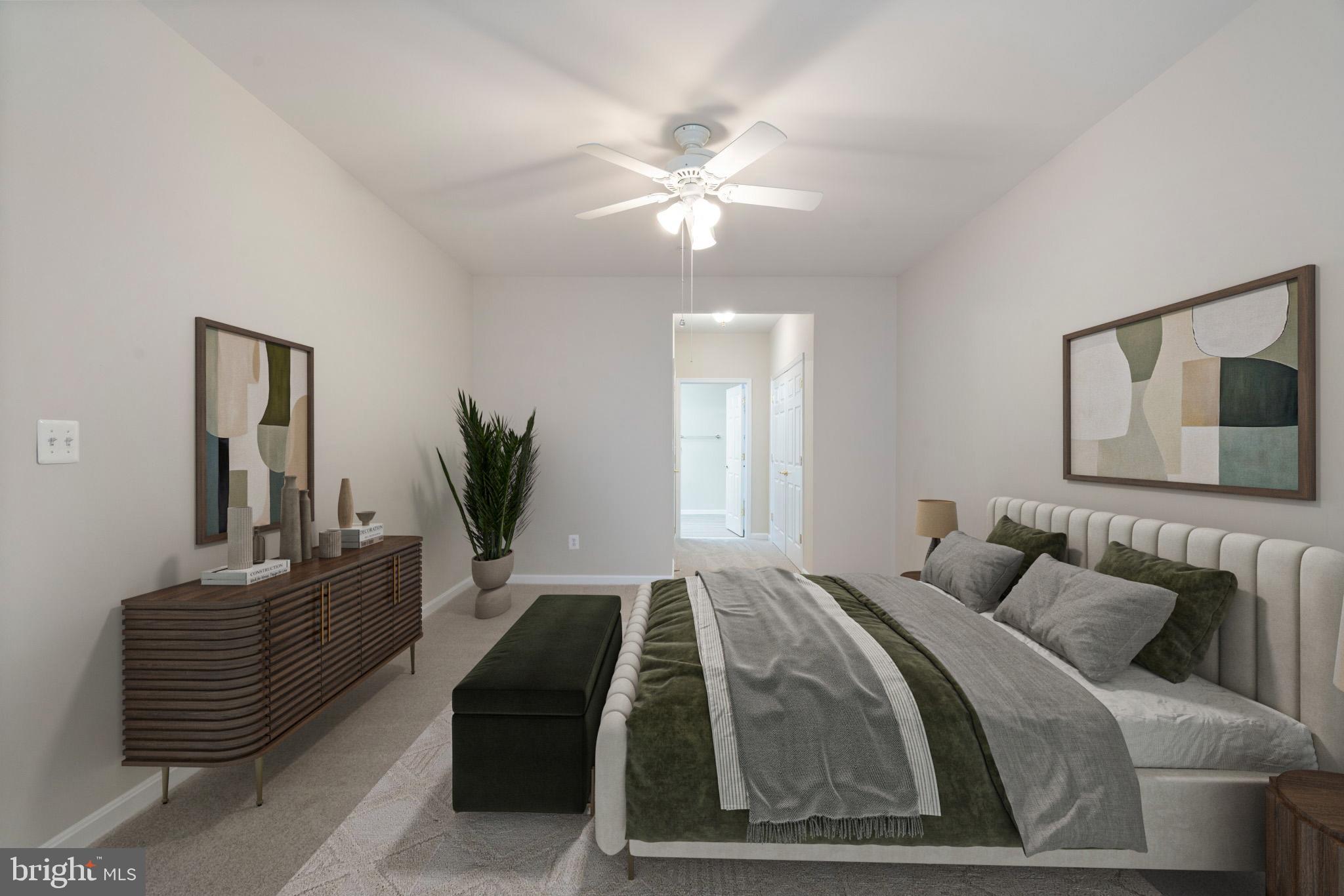 20751 Royal Palace Square, Unit 104 Sterling, VA 20165 - Photo 21 of 44 a bedroom with a bed and dresser with mirror