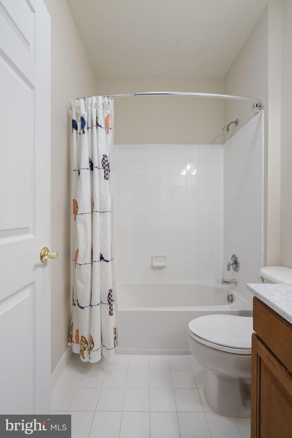 20751 Royal Palace Square, Unit 104 Sterling, VA 20165 - Photo 34 of 44 a bathroom with a shower a toilet and a sink