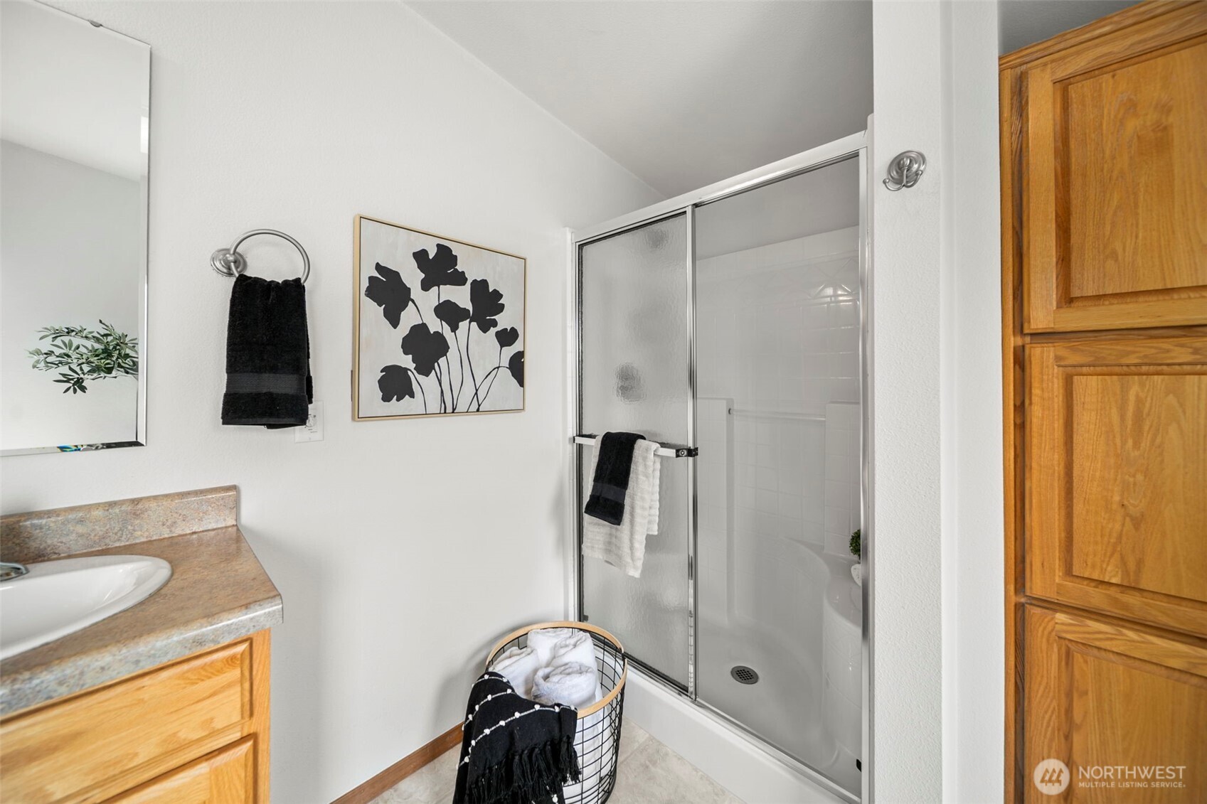756 Totem Pole Road Manson, WA 98831 - Photo 19 of 39 a bathroom with a granite countertop sink mirror vanity and shower