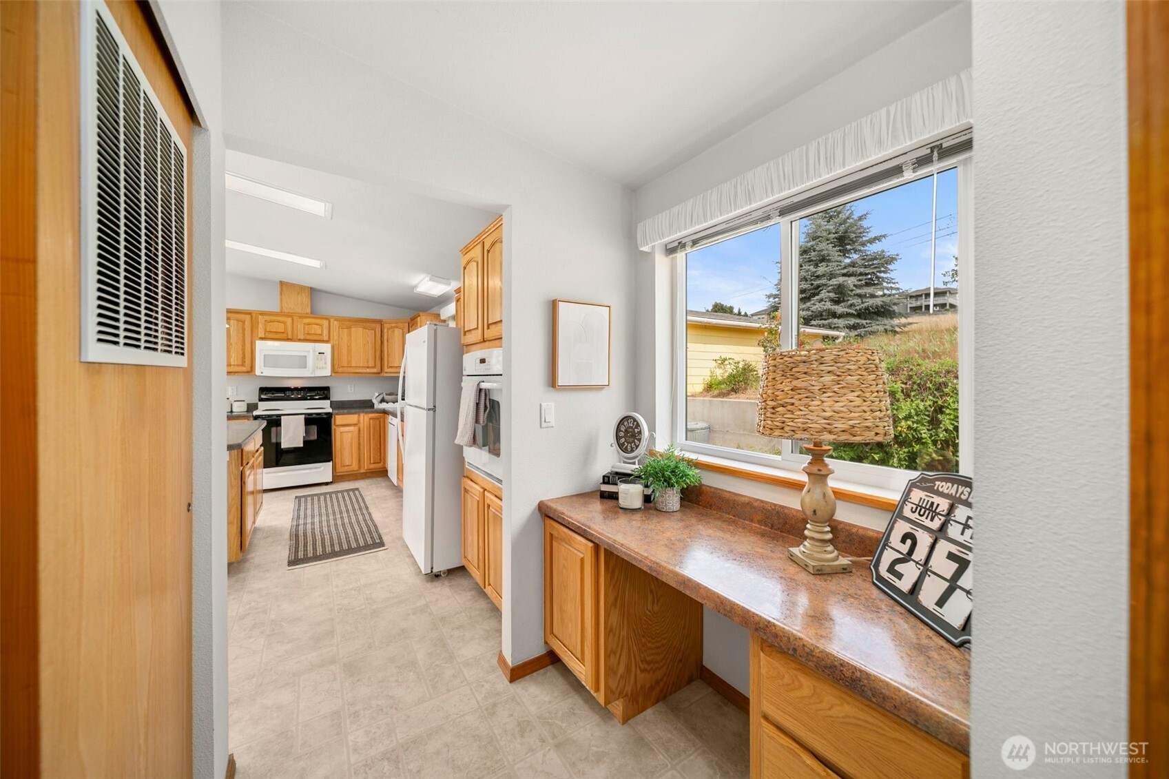 756 Totem Pole Road Manson, WA 98831 - Photo 21 of 39 a kitchen with stainless steel appliances a sink and a refrigerator