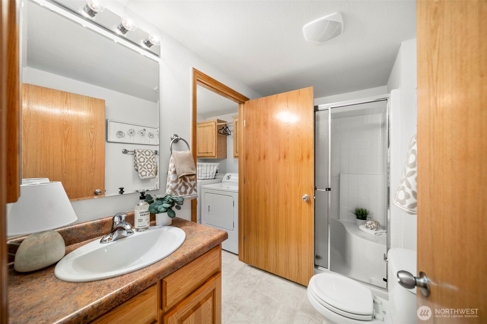 756 Totem Pole Road Manson, WA 98831 - Photo 22 of 39 a bathroom with a granite countertop sink toilet and shower