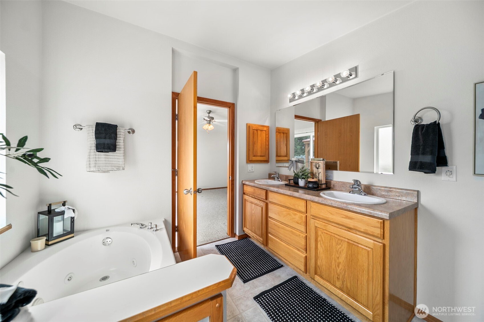 756 Totem Pole Road Manson, WA 98831 - Photo 25 of 39 a bathroom with a tub a sink and mirror