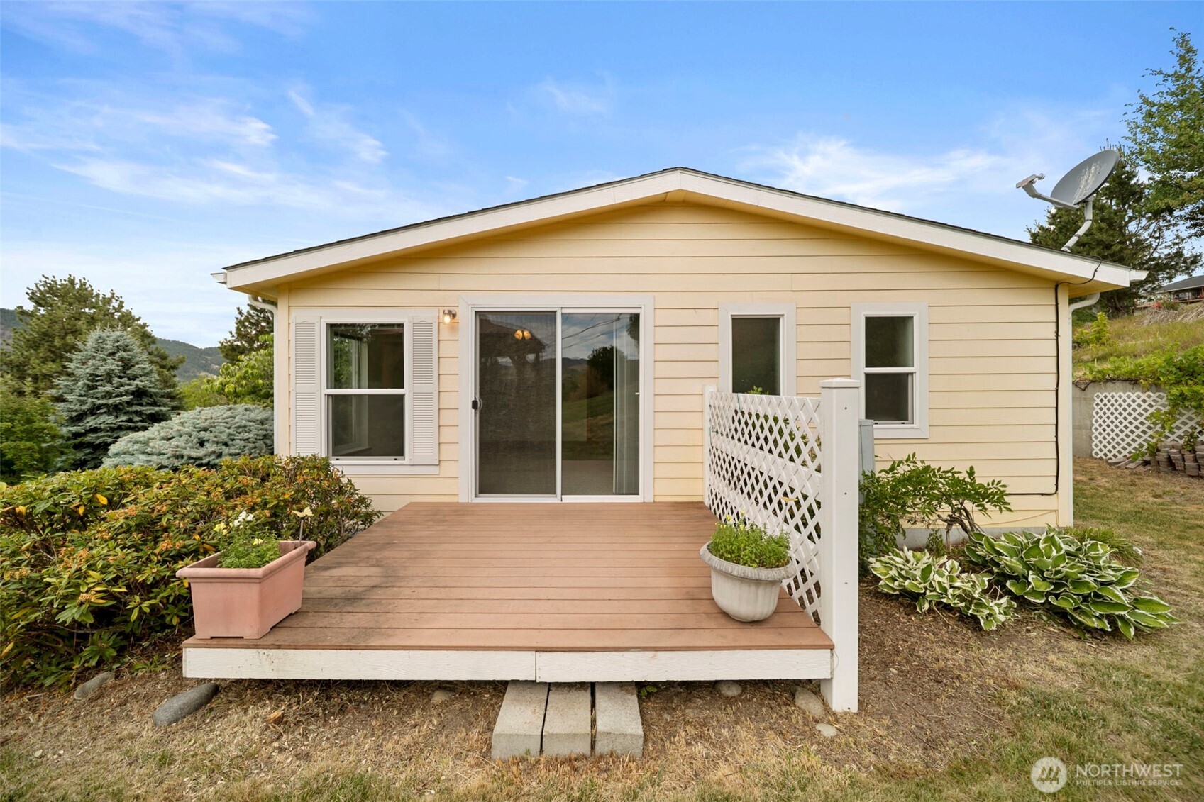 756 Totem Pole Road Manson, WA 98831 - Photo 26 of 39 a front view of a house with a yard