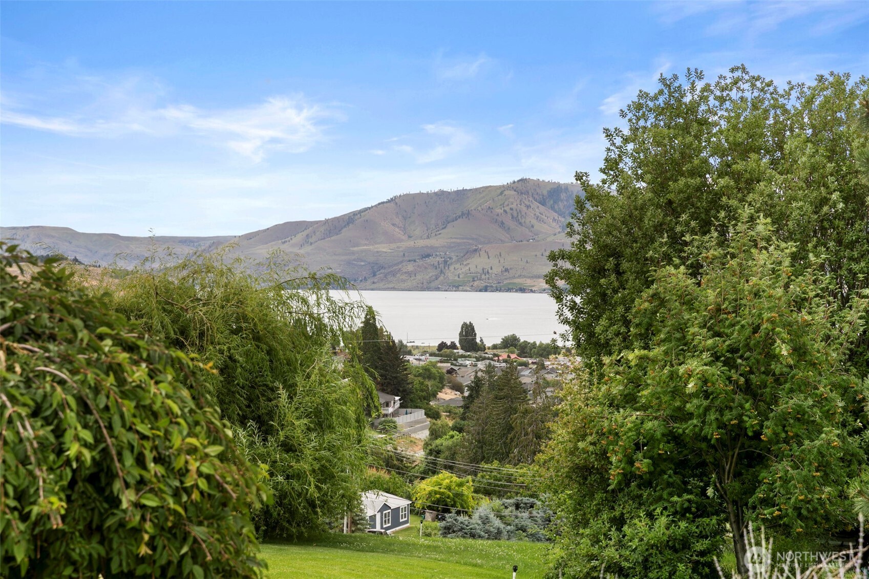 756 Totem Pole Road Manson, WA 98831 - Photo 32 of 39 a view of a city with a mountain