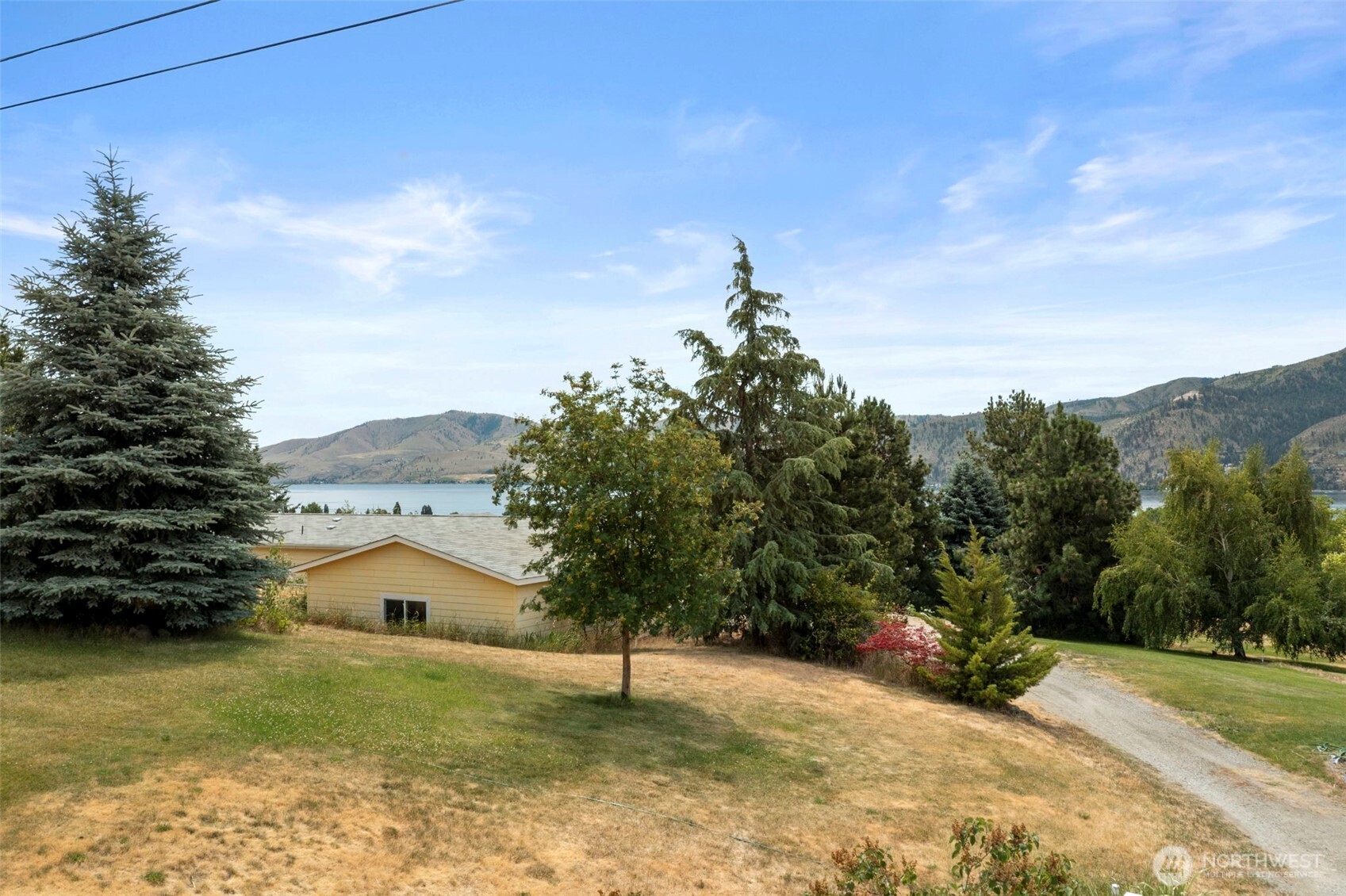 756 Totem Pole Road Manson, WA 98831 - Photo 36 of 39 a view of a house with a yard