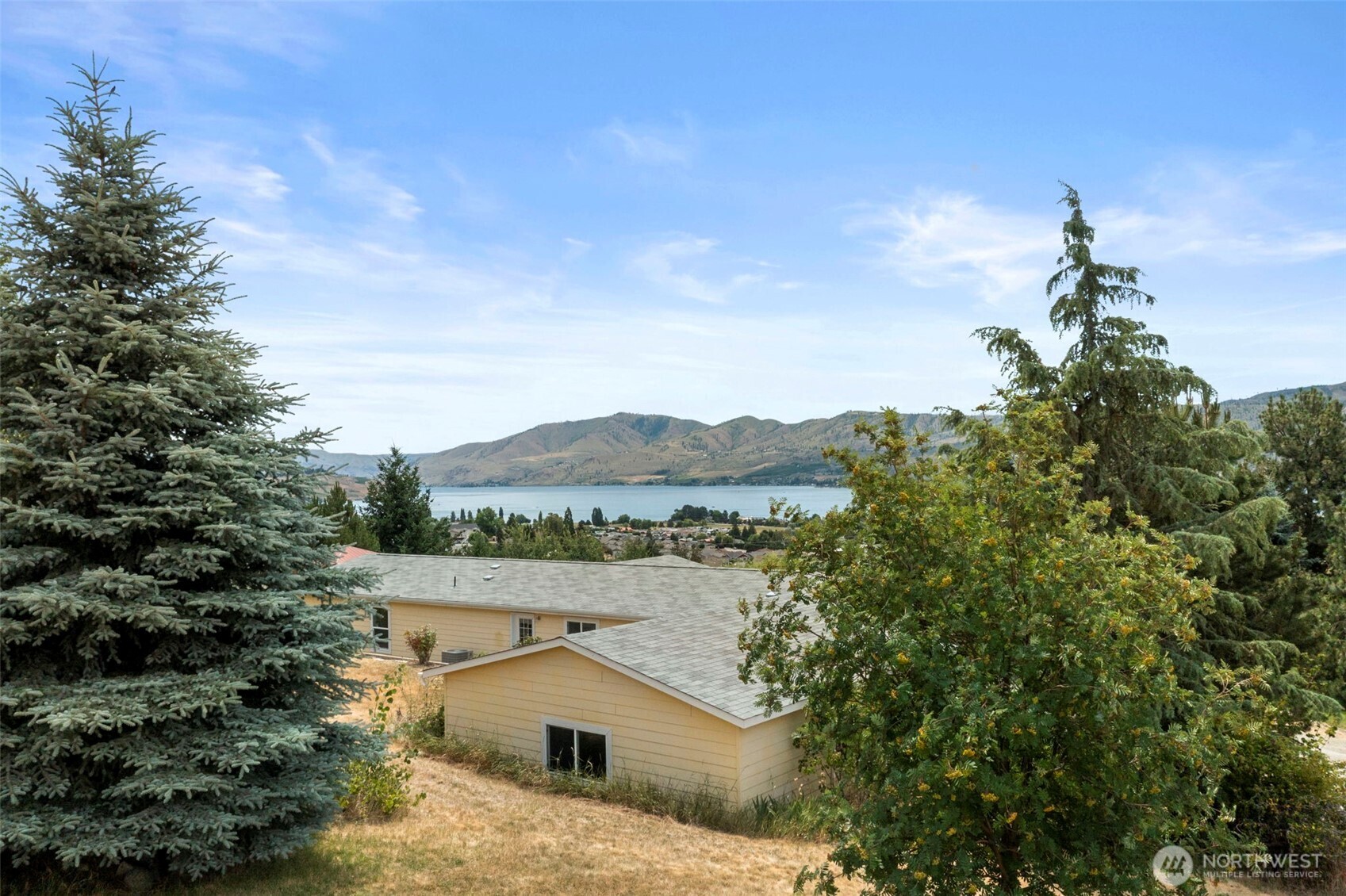 756 Totem Pole Road Manson, WA 98831 - Photo 38 of 39 a view of a lake with a mountain in the background