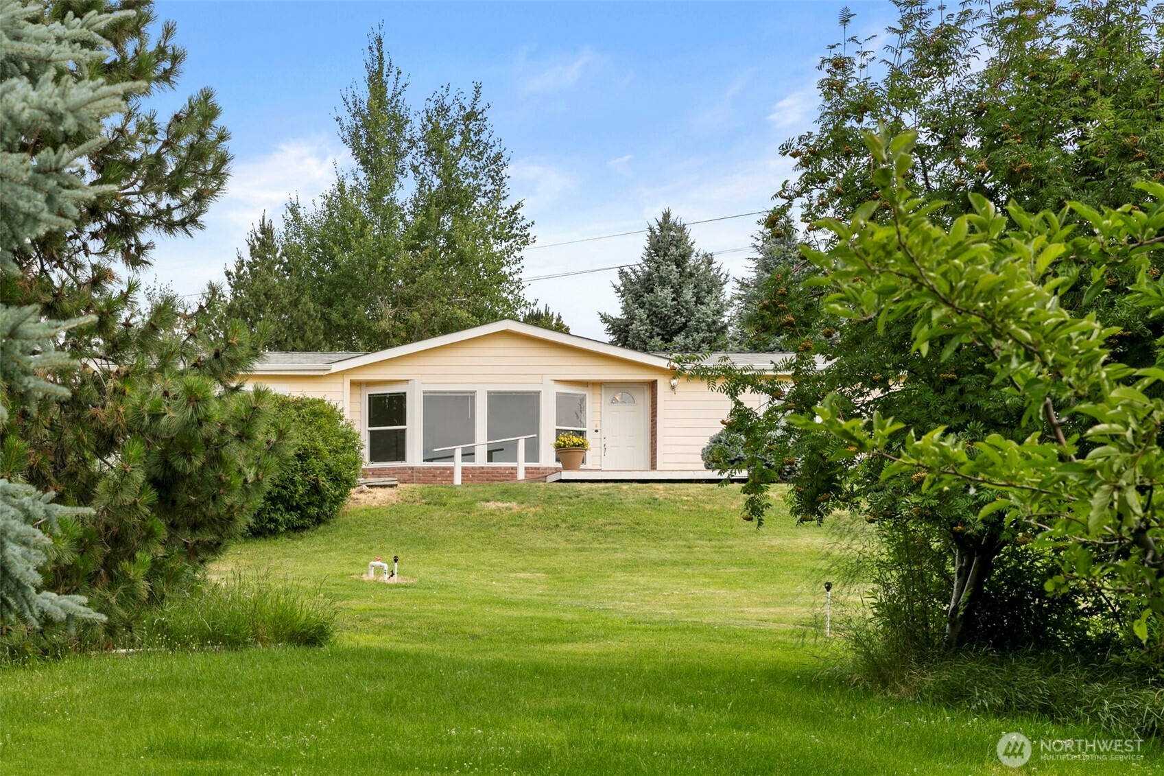 756 Totem Pole Road Manson, WA 98831 - Photo 6 of 39 a front view of a house with a yard