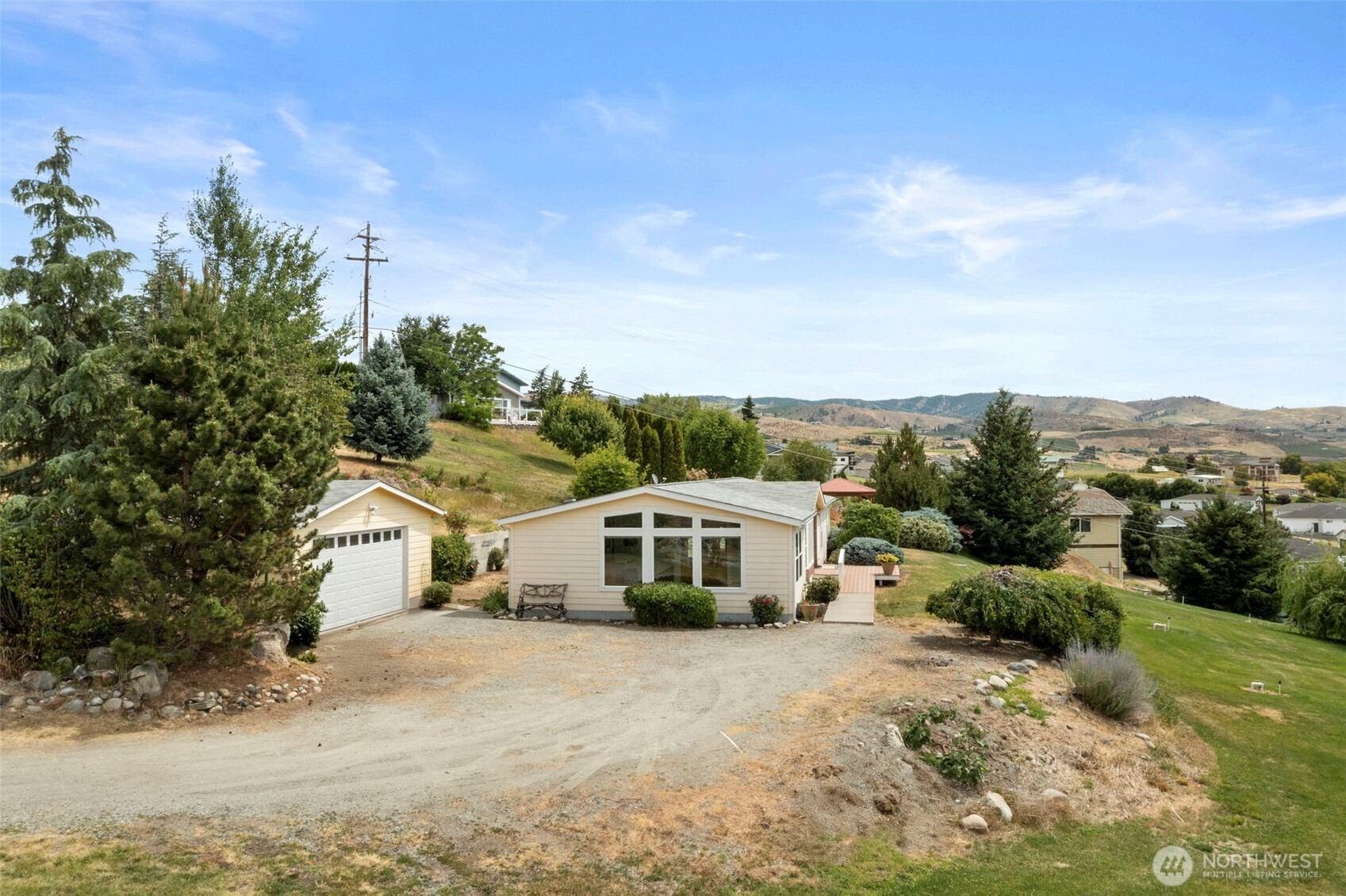 756 Totem Pole Road Manson, WA 98831 - Photo 7 of 39 a white building with a big yard