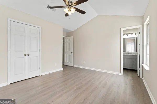 a view of a room with a windows and wooden floor
