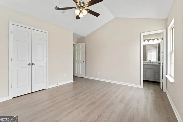 a view of a room with a windows and wooden floor
