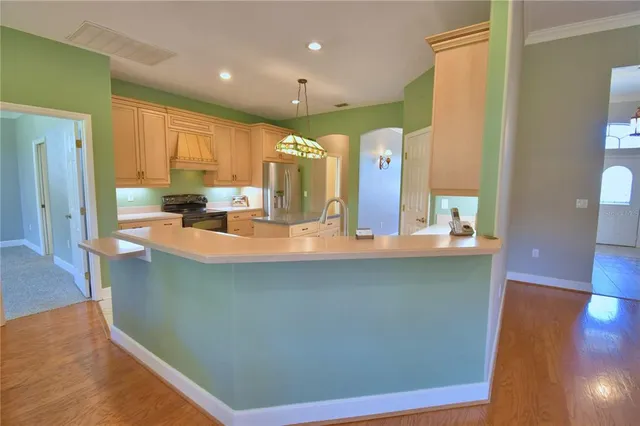 an empty room with a ceiling fan and a window