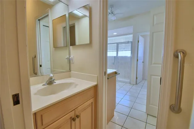 a bathroom with a sink toilet and a mirror