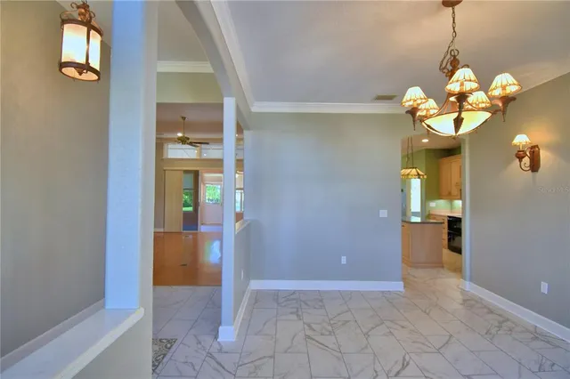 a view of an empty room with a dresser