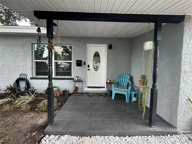 a backyard of a house with palm trees