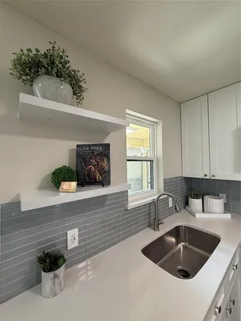 a kitchen with a sink and a window