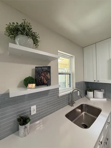 a kitchen with a sink and a window