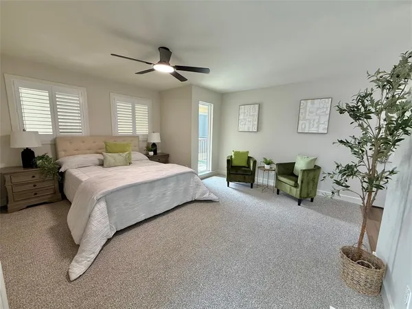 a bedroom with bed and a chandelier
