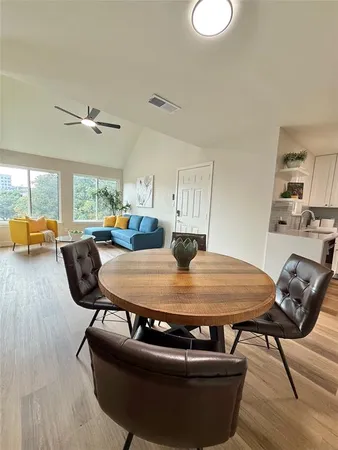 a room with furniture and wooden floor