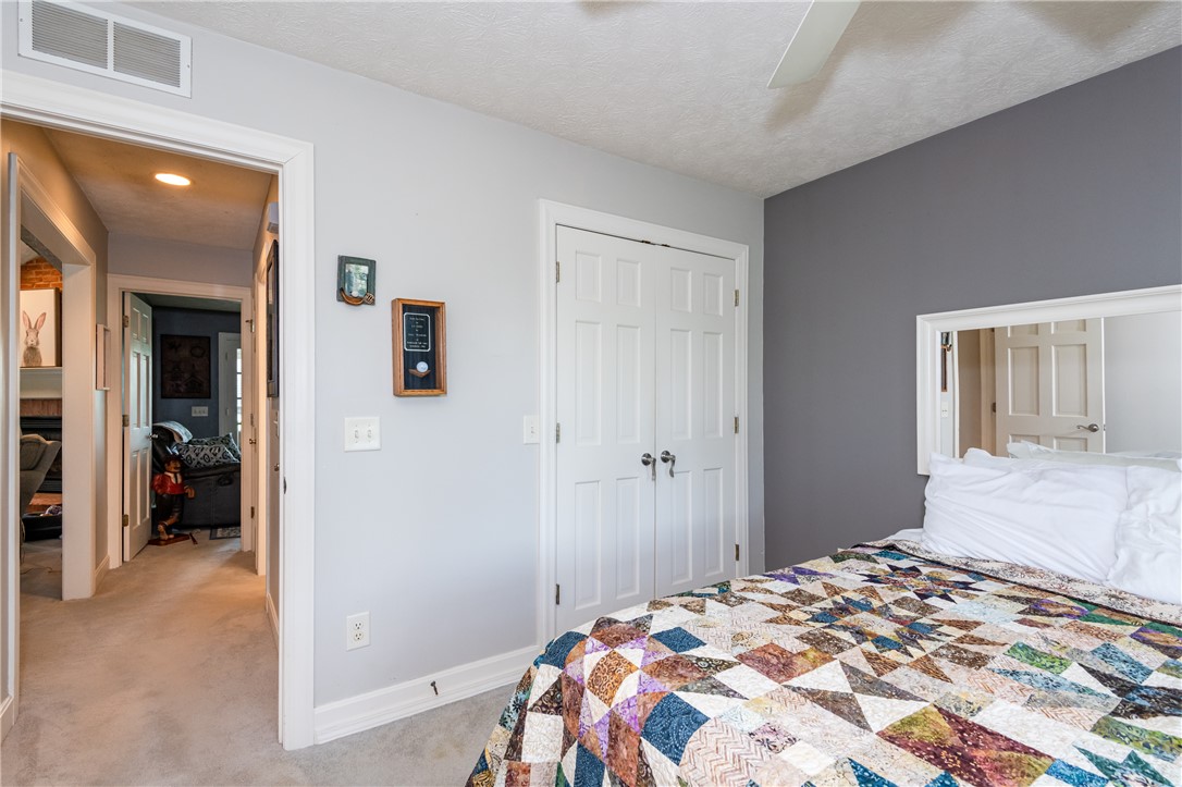 159 East Lytle 5 Points Road Springboro, OH 45066 - Photo 19 of 45 This cozy bedroom features comfortable flooring and a refreshing ceiling fan.